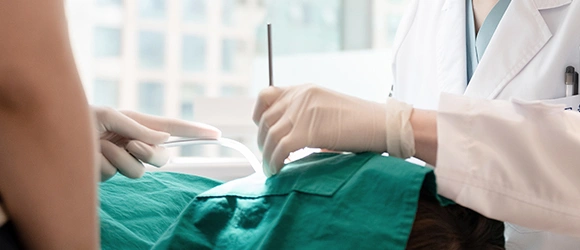 Surgery by a clinician experienced in revisions